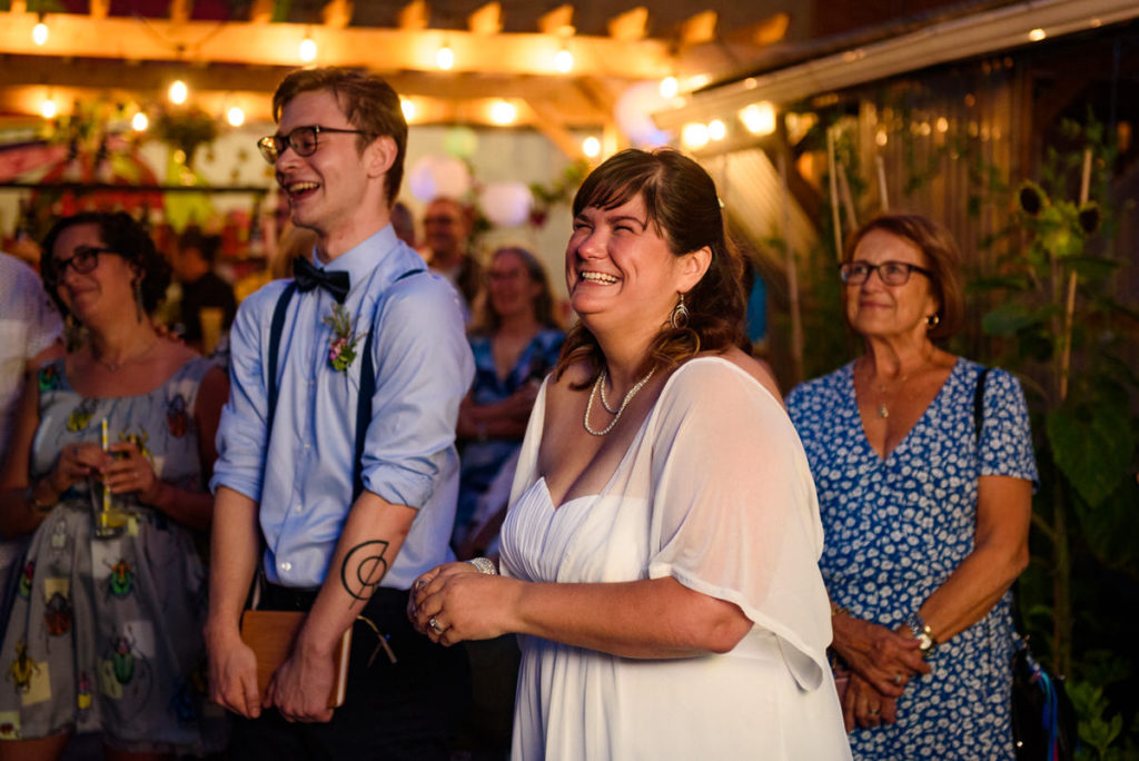 Bride laughing at a speech