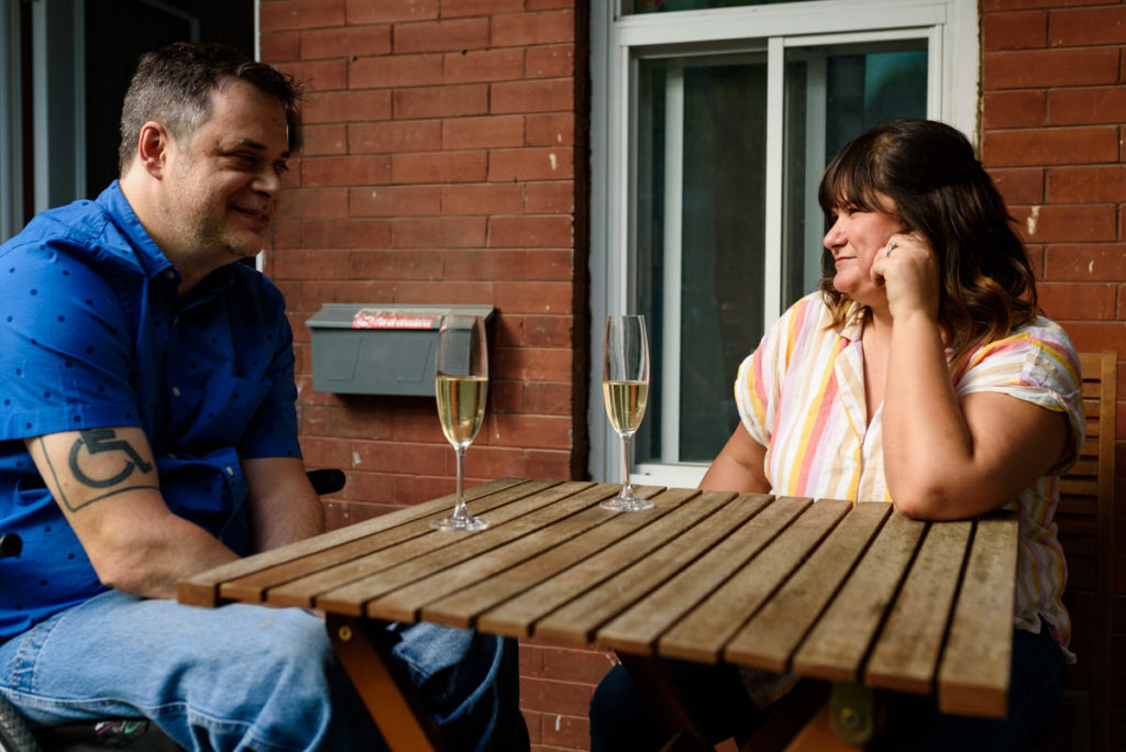 Couple looking at each other at patio table