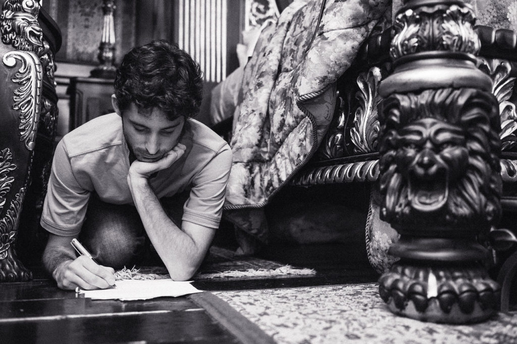 Groom writing his vows the morning of the wedding