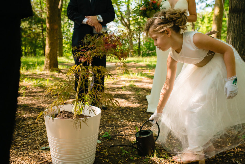 Flower girl watering the unity tree