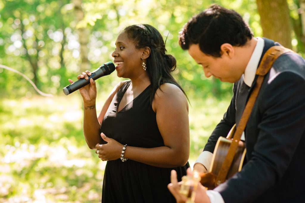 Friend singing during wedding signing