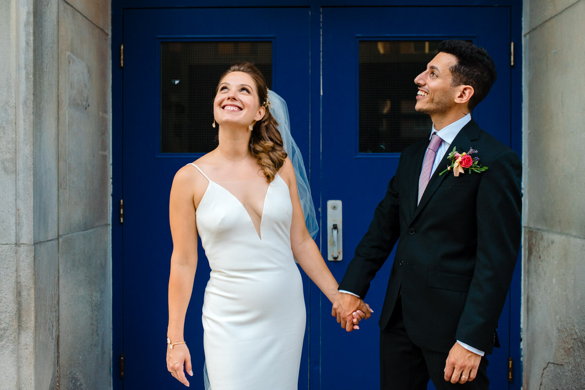 Bride and groom portrait in front of blue door in Montreal
