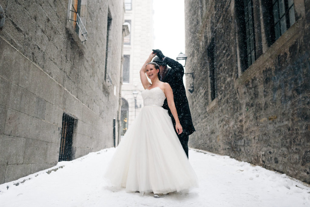 Wedding couple dancing in the snow