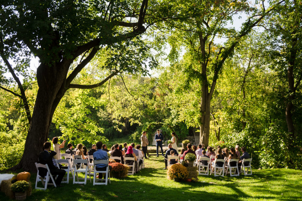 Outdoor wedding ceremony at Cafe de l'Horloge in Rigaud