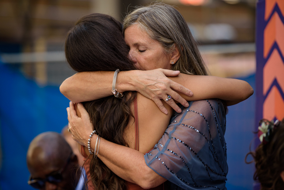 Mother hugging her daughter after speech