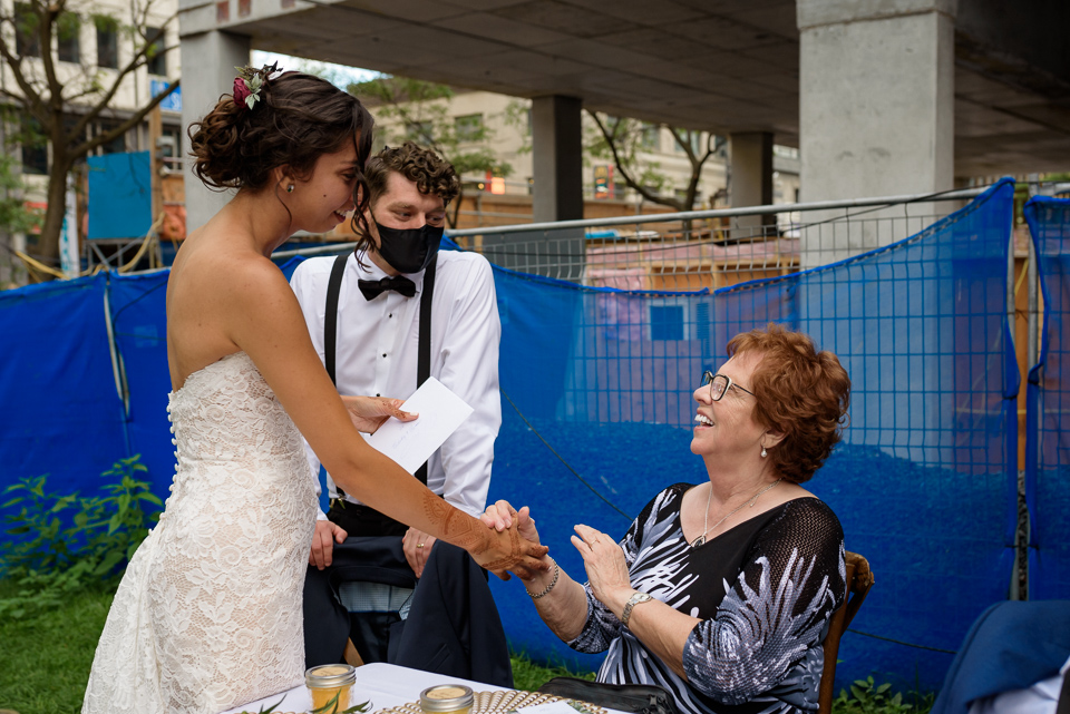 Grandma patting the bride's hand