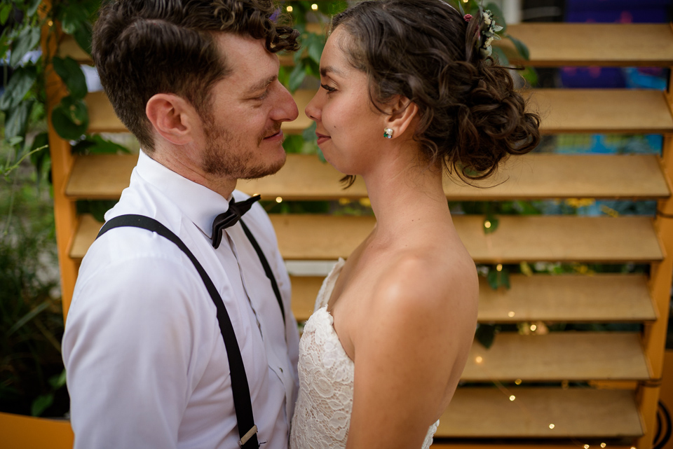 Close up portrait of wedding couple looking at each other