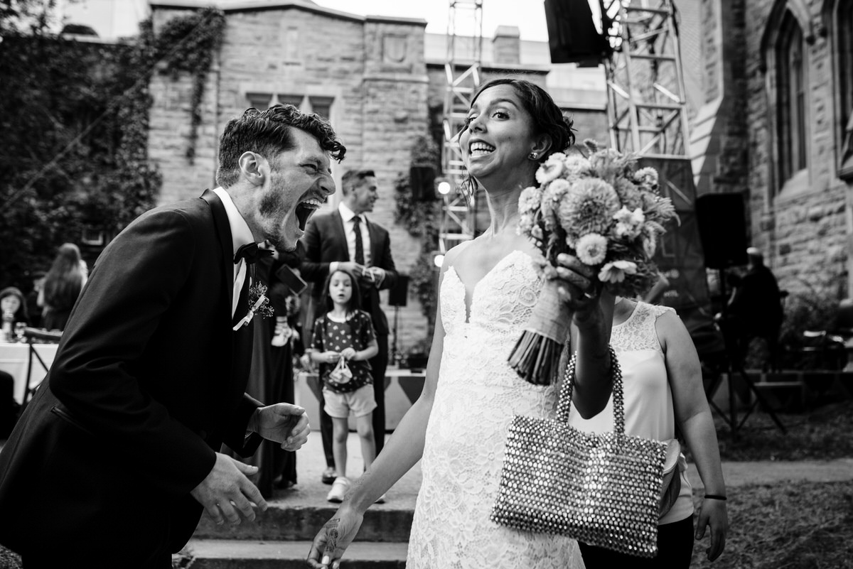 Bride gasps in excitement as groom grins in glee